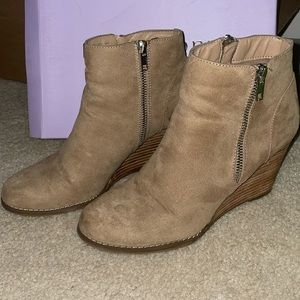 Tan suede wedge heels, with fashion zippers on the side.
